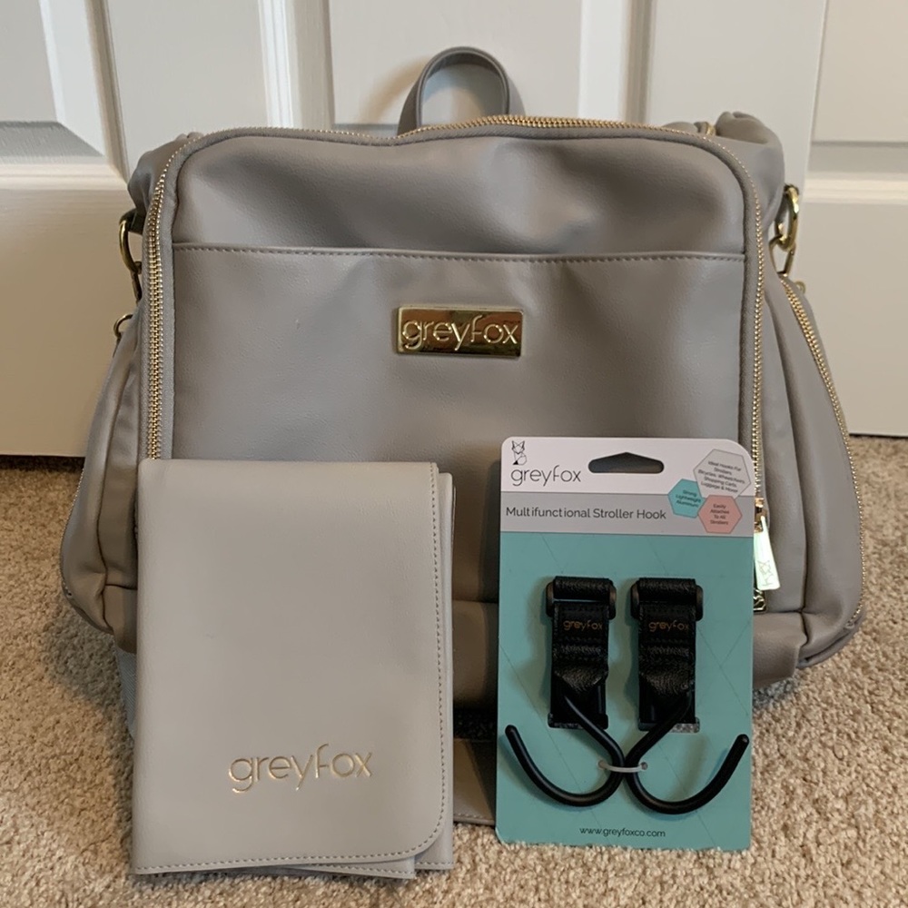 Greyfox diaper bag with changing pad and brand new stroller hooks.